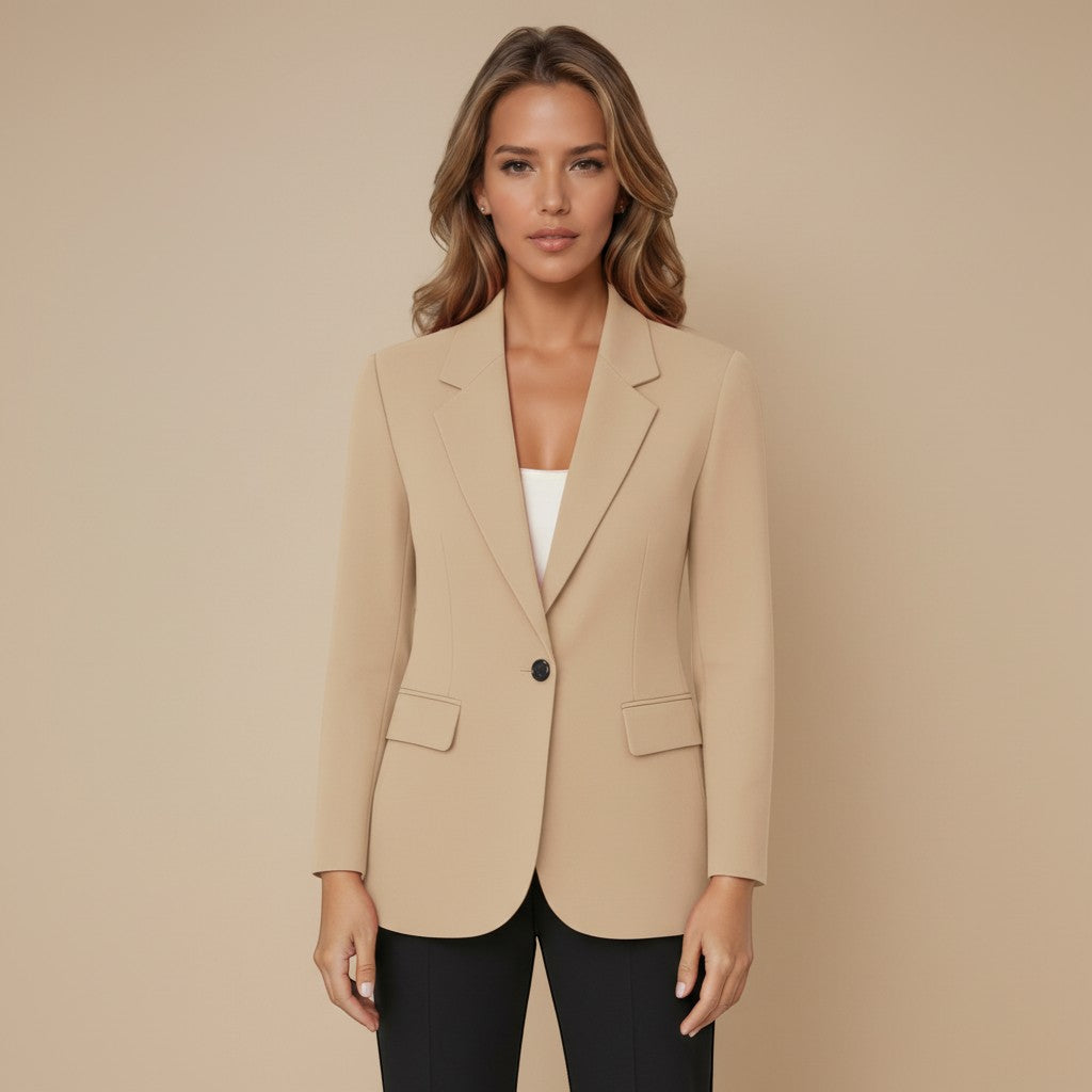 Yemelia beige tailored single button blazer with structured fit, classic lapels, and flap pockets. Smooth fabric, ideal for workwear.