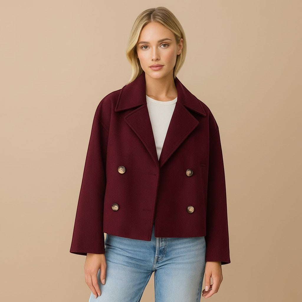 Yemelia cropped double-breasted tailored jacket in burgundy with wide lapels and button front.