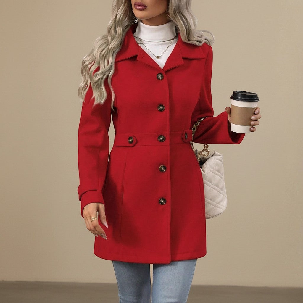 Yemelia red tailored mid-length coat with button front, classic collar, and waist belt. Made from a structured fabric.